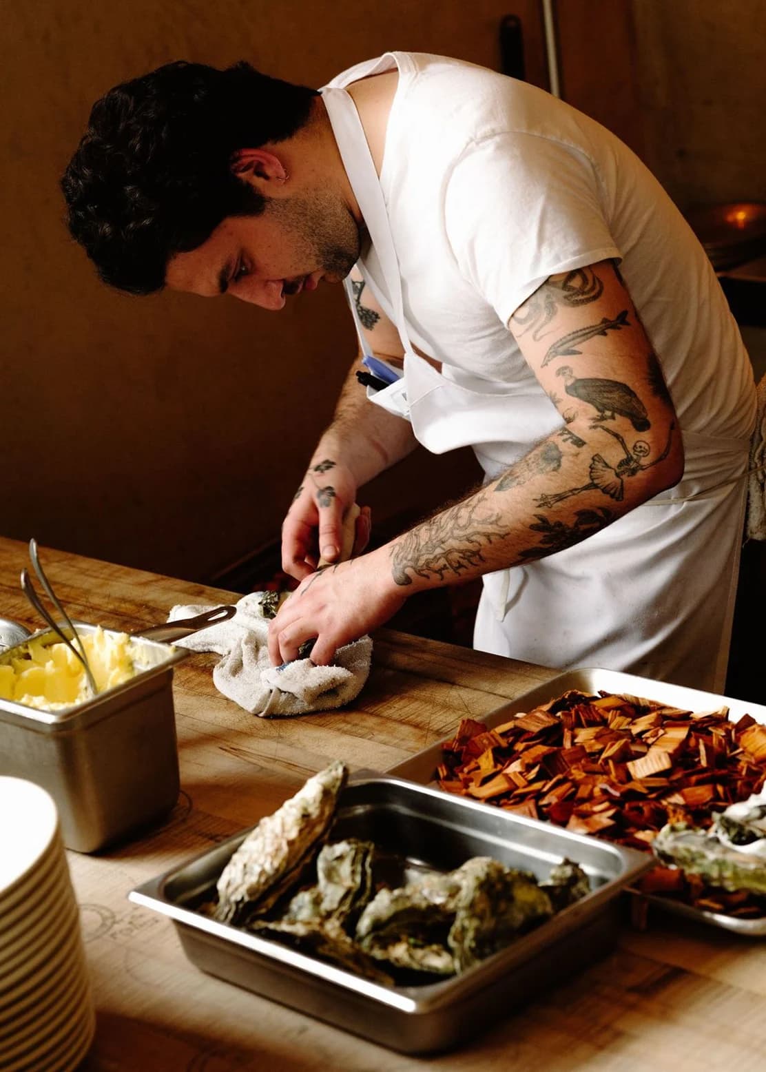 A chef preparing ingredients behind the counter
